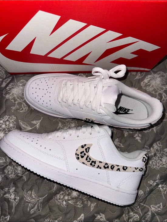 Nike Shoes - Nike White Women's Low-Top Sneakers with Leopard Swoosh